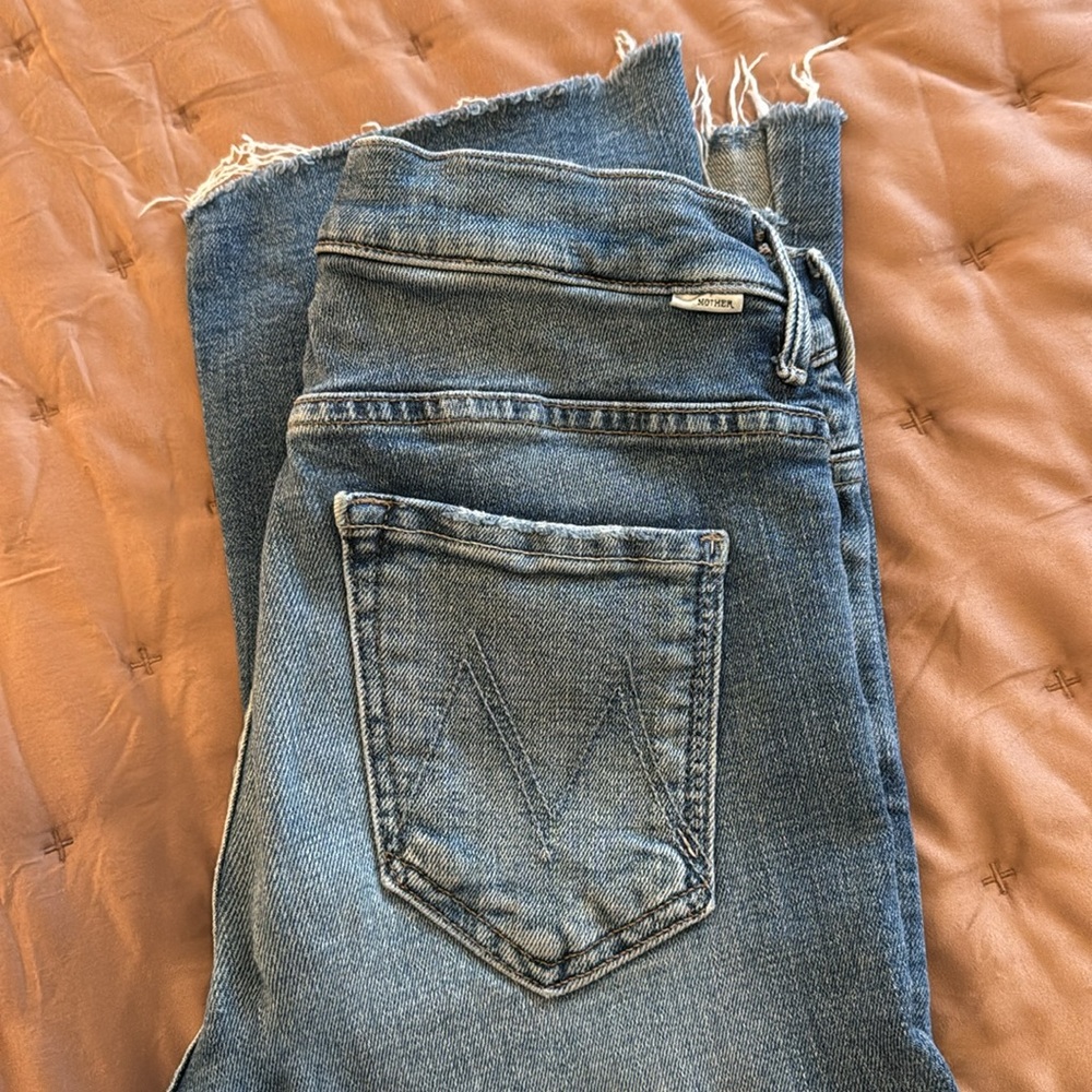 Mother frayed jeans